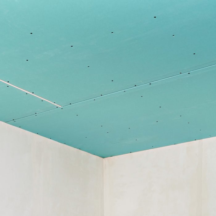Plasterboard ceiling on an installed profile frame. Apartment or office renovation. A cheap and quick way to make a partition or ceiling in a room or warehouse.